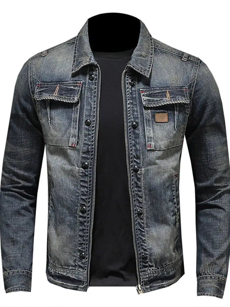 Distressed dark wash denim jacket for men with button and zipper closure and chest pockets featuring brown leather patches.