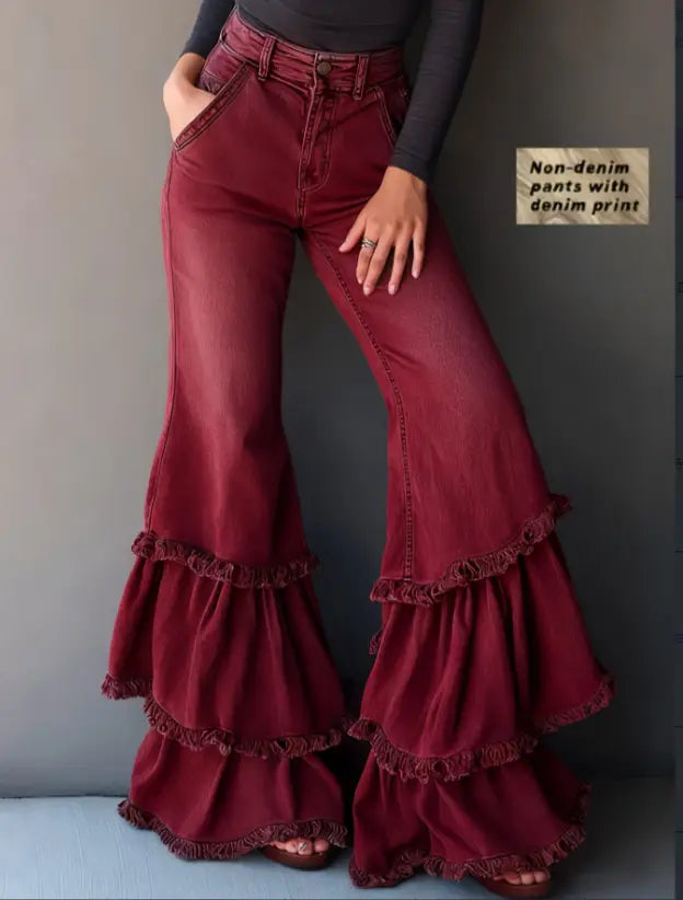 Maroon denim print ruffled flared pants featuring layered ruffled hems shown from the back.