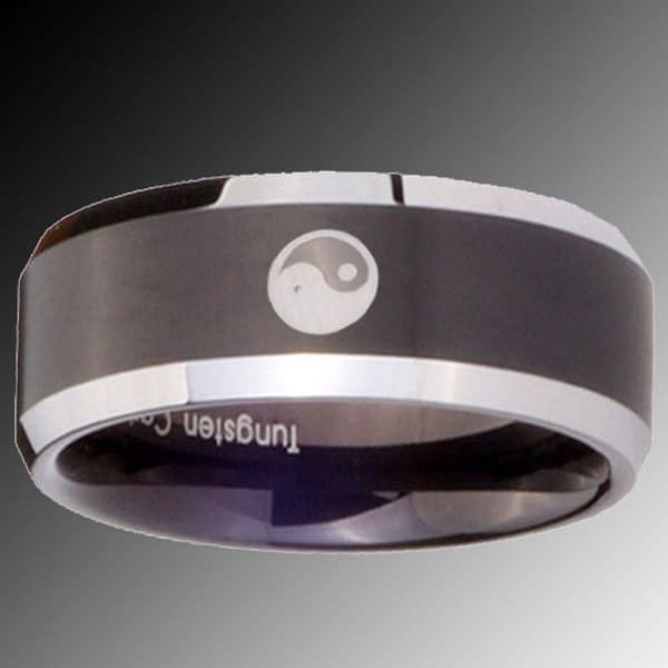 A black tungsten wedding ring with green aluminum 8mm band featuring a sleek black and silver polished yin-yang symbol engraved on its center.
