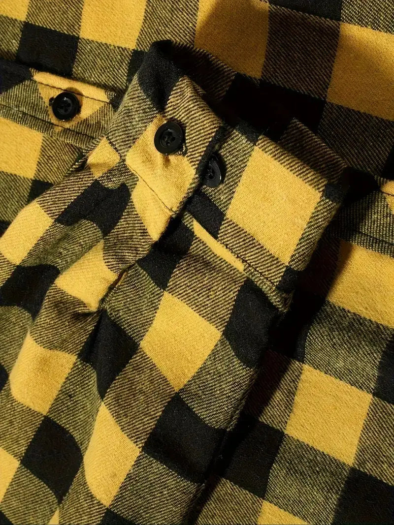 Men’s plaid hooded flannel shirt in yellow and black plaid pattern with dark buttons made of soft flannel material.
