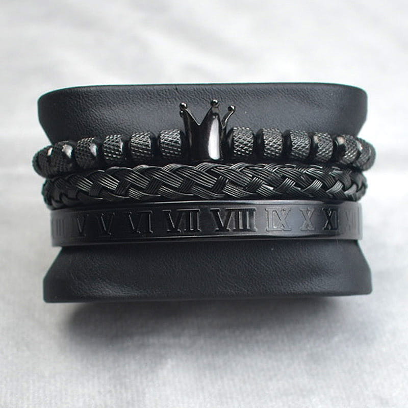 Black crown-themed bracelet set featuring braided black leather, textured diamond beads, and a roman numeral band named Crown Royal Diamond Beaded Bracelet Set with Braided Bands.