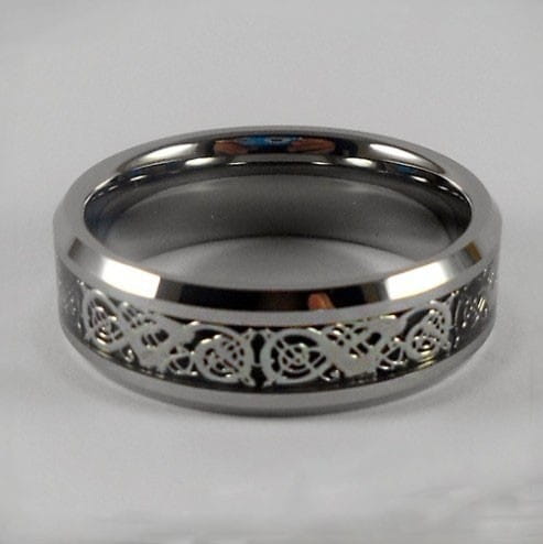 A sleek silver-toned tungsten carbide wedding ring with an intricate engraved Celtic knot pattern and green aluminum inlay, 8mm band.