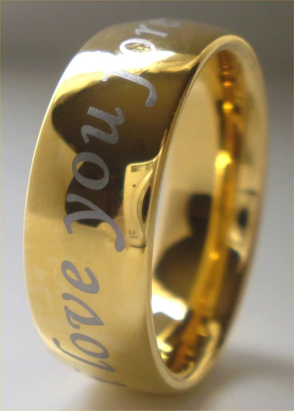 black tungsten wedding ring with green aluminum 8mm showcasing a sleek gold-colored titanium band engraved with i love you in flowing cursive on its inner surface.