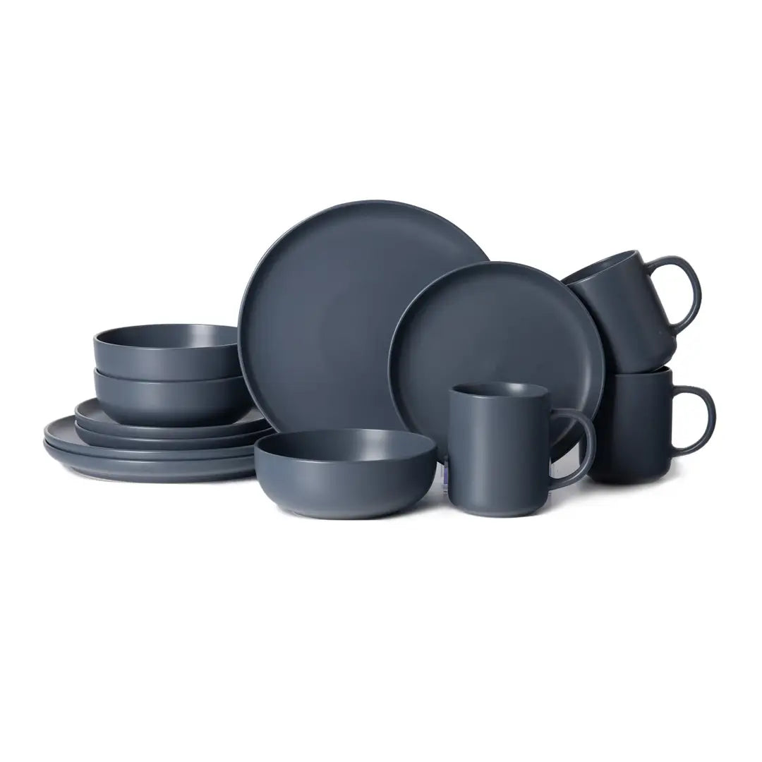 Matte dark gray ceramic 12-piece stoneware dinnerware set with minimalist design and rounded edges for service for 3.