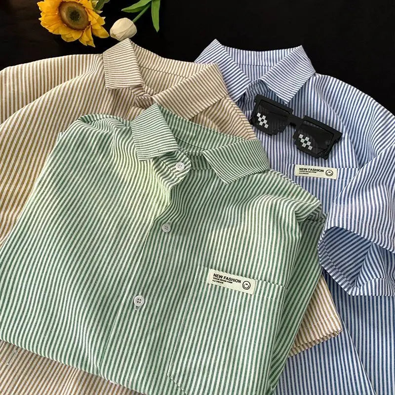 Plus size green and white striped short-sleeved casual shirt with a chest pocket featuring a new fashion label.