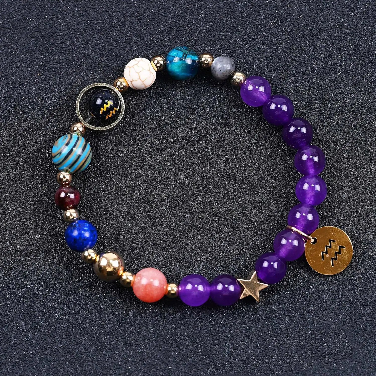 A colorful natural amethyst and agate twelve zodiac beaded bracelet featuring purple, blue, and gold-toned beads with a star charm and zodiac symbol pendant.
