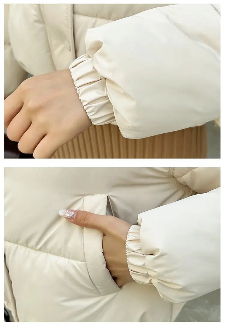 Cremefarbene leichte Kapuzen-Pufferjacke aus Baumwolle mit Steppdesign und elastischen Bündchen.