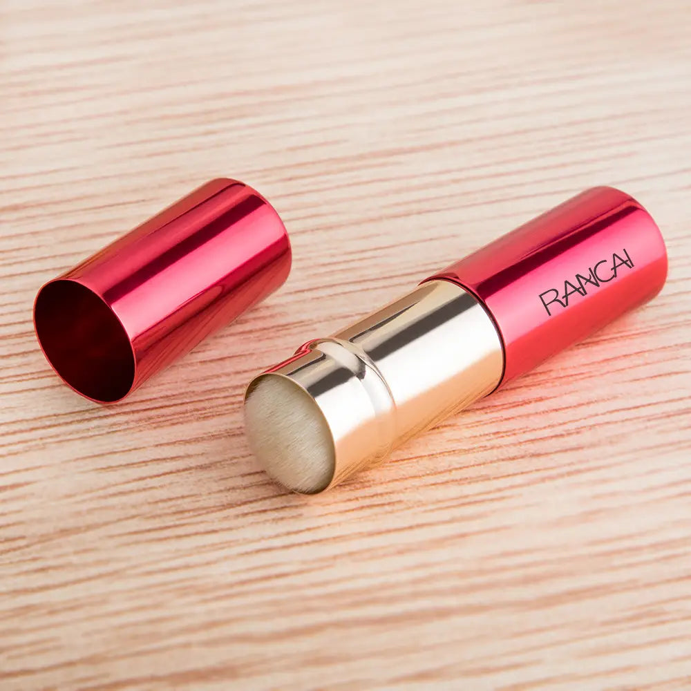 Red metallic retractable makeup brush with gold-colored cap and rancai branding for precise application.