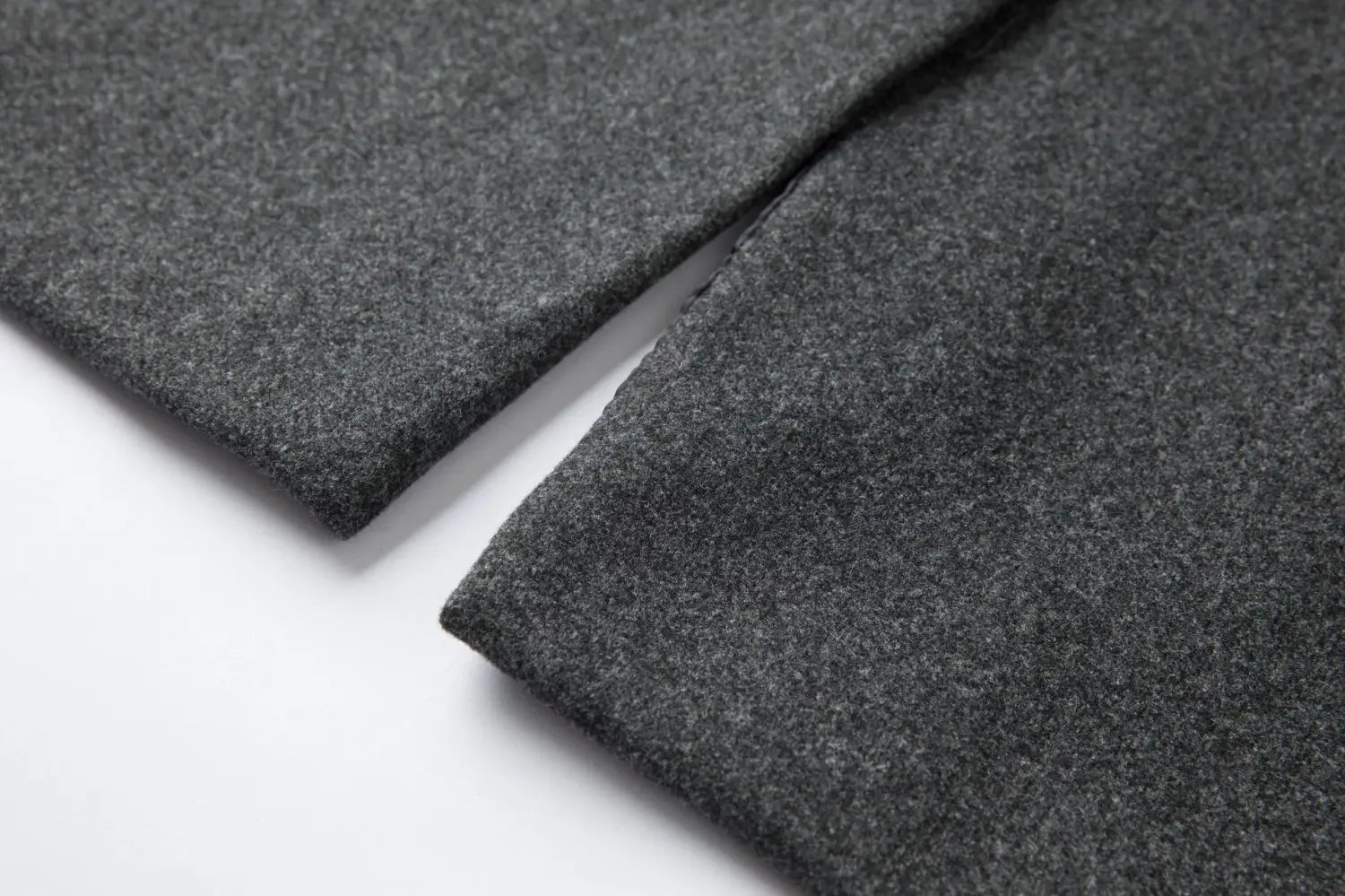 men double breasted wool overcoat mid length coat made of dark gray soft textured woolen fabric.