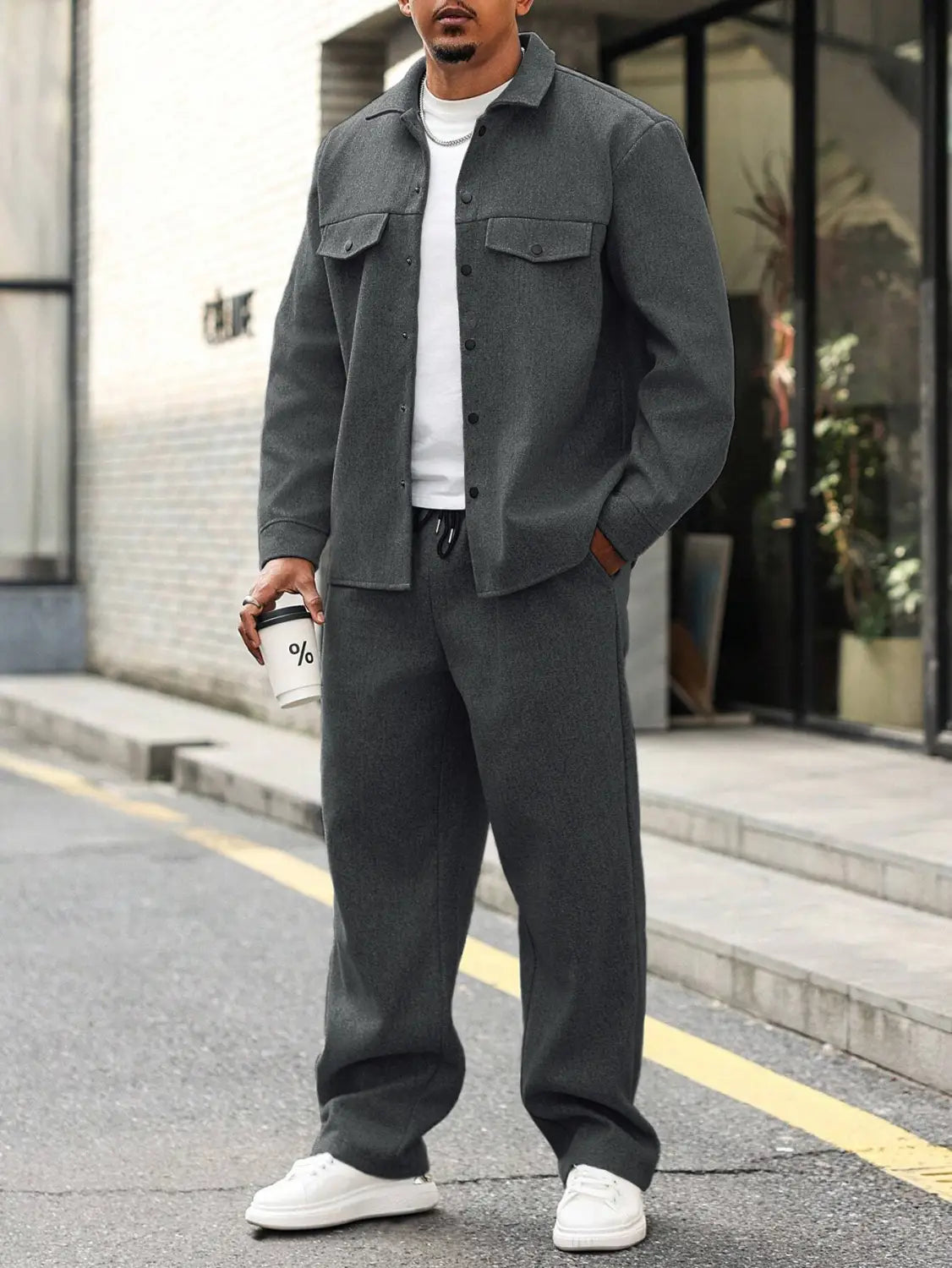 Dark gray textured woolen button-up shirt with two chest pockets and a collar in mens cargo jacket and pants set.