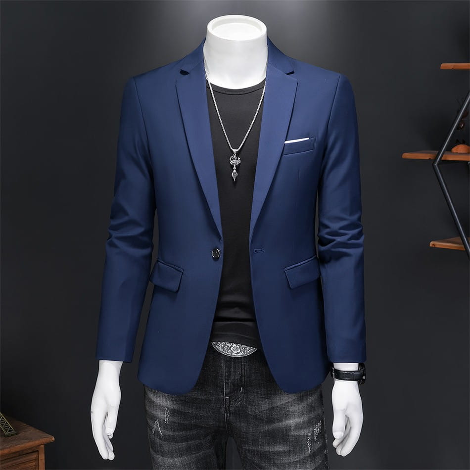 Chaqueta de vestir empresarial de pana azul marino con ajuste slim, solapas a pico tipo muesca a medida y bolsillos con solapa.