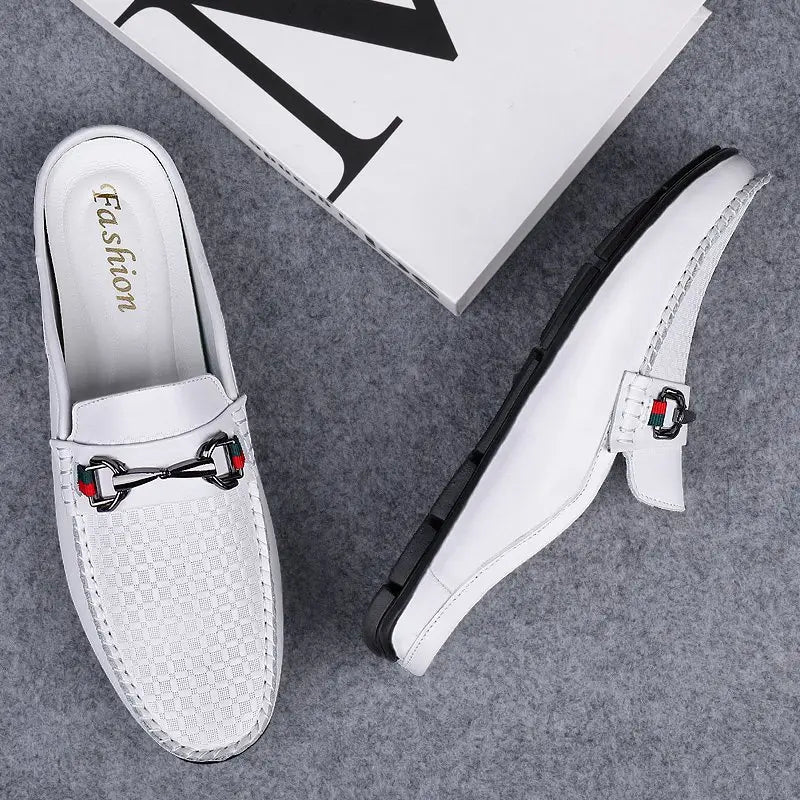 Men’s white leather mule loafers with a textured pattern and black metal horsebit buckle featuring red and green accents.