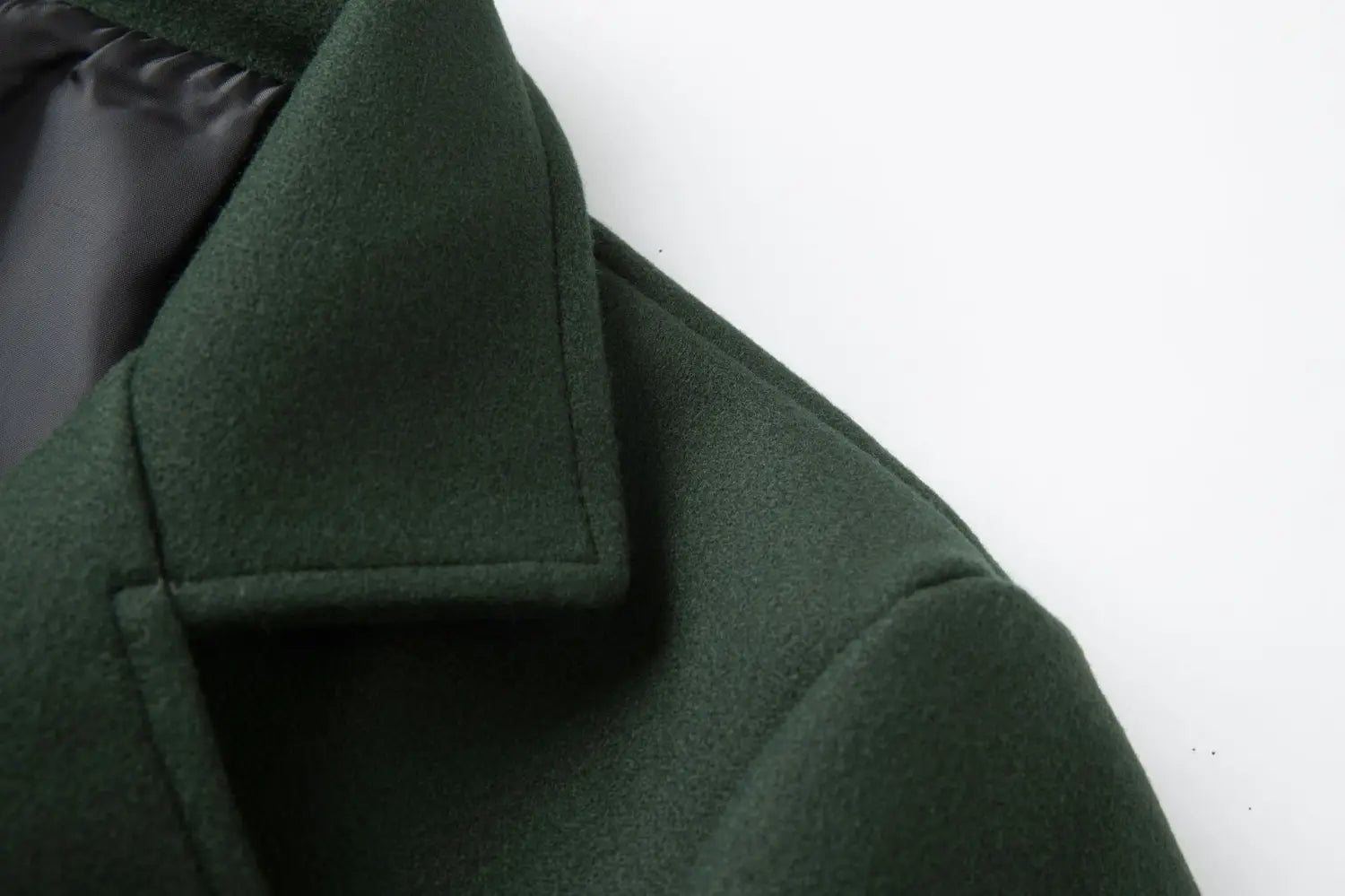 Dark green men double breasted wool overcoat with a structured collar and subtle texture mid length coat.