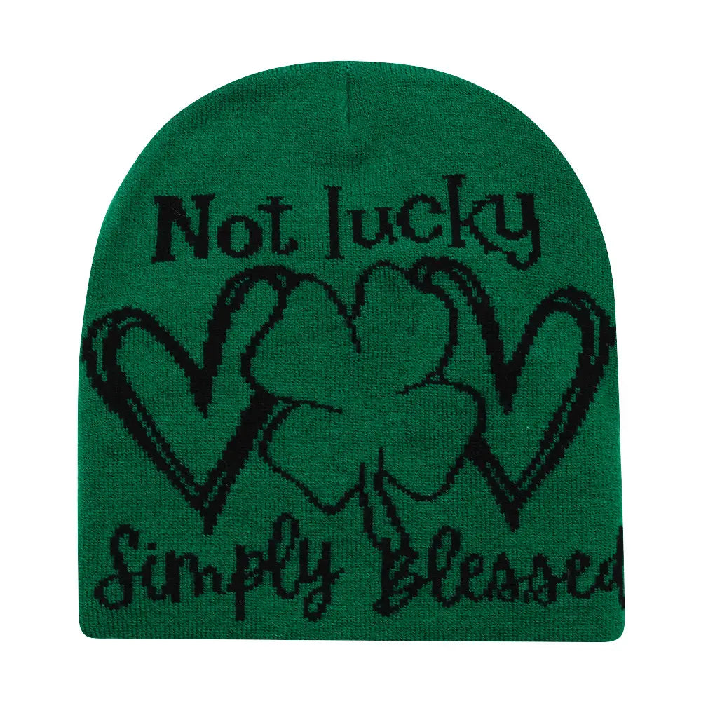 Green knitted lucky beanie winter warm hat featuring black embroidered text and shamrock design.