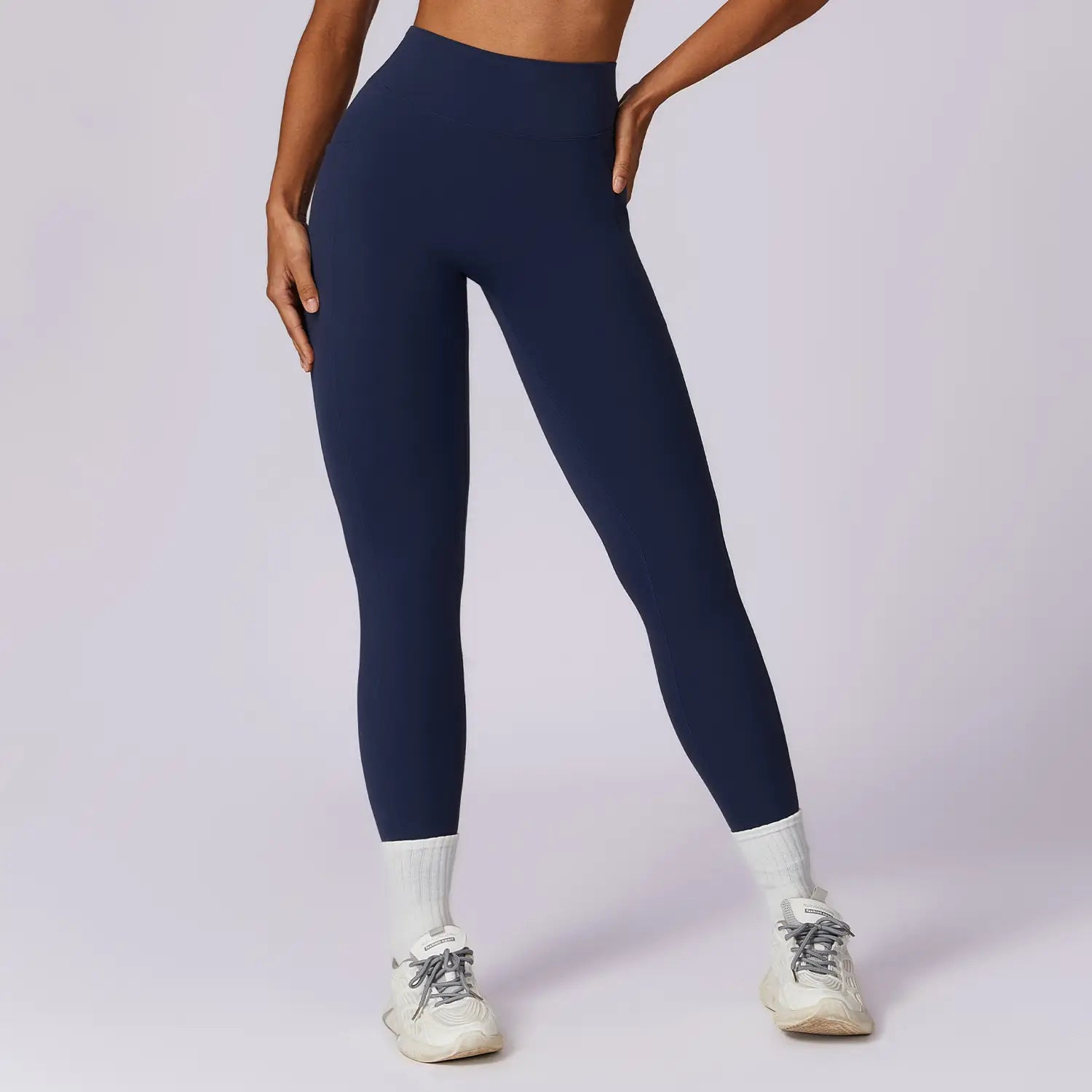 Navy blue seamless elite high waisted athletic leggings made from smooth stretchy fabric for enhanced comfort and performance.