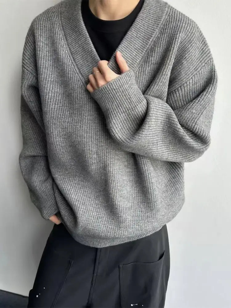 Gray ribbed knit v-neck pullover sweater with a relaxed oversized fit for comfortable casual wear