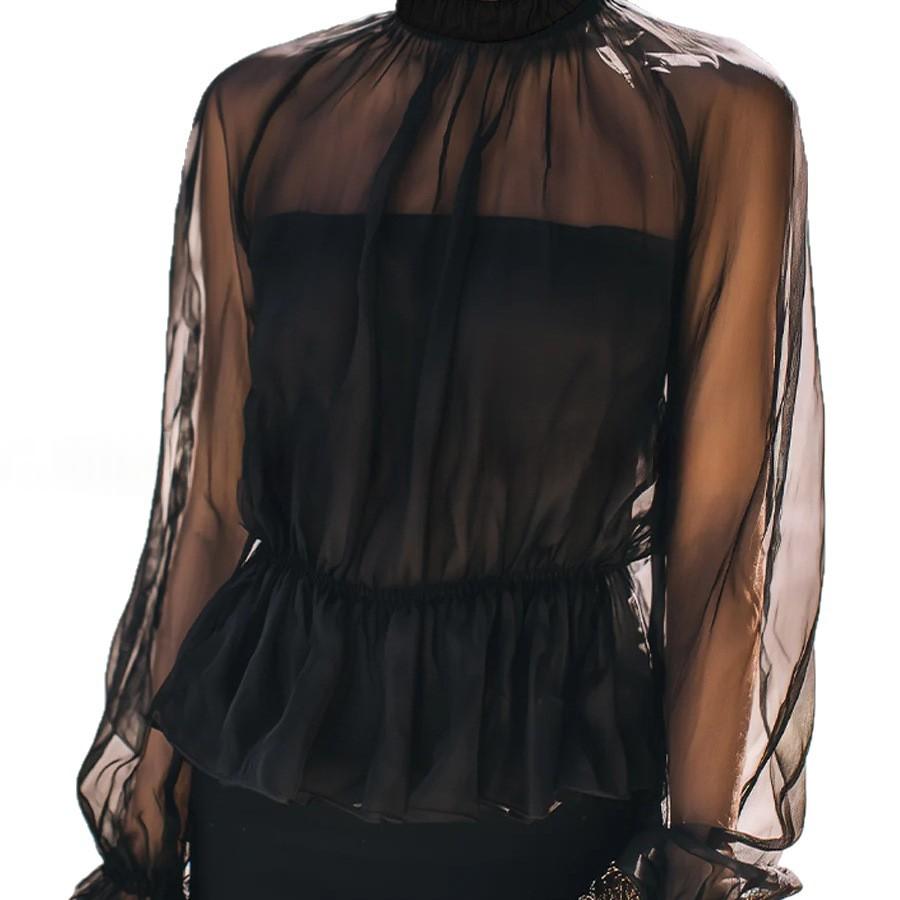 black sheer ruffled peplum blouse with a high neckline long sleeves and delicate fabric details