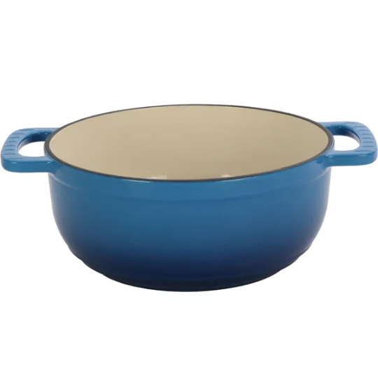 6qt enameled cast iron dutch oven with blue gradient enamel coating cream-colored interior and sturdy handles shown with silicone gloves.