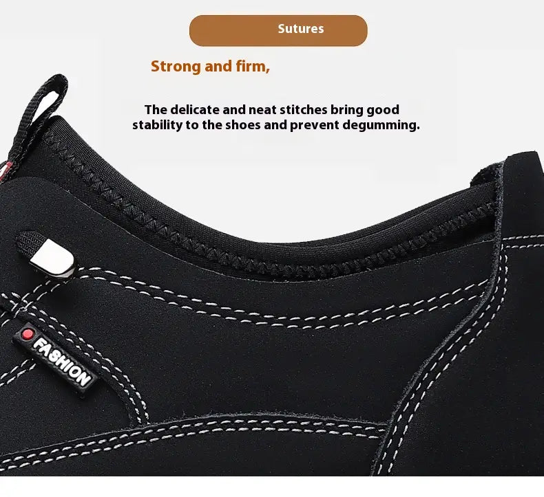 Men’s suede casual sneakers in black with white stitching and a small fashion brand tag on a chunky rubber sole.