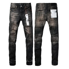 men’s distressed slim fit patchwork denim jeans in dark wash with a faded look and visible stitching details.