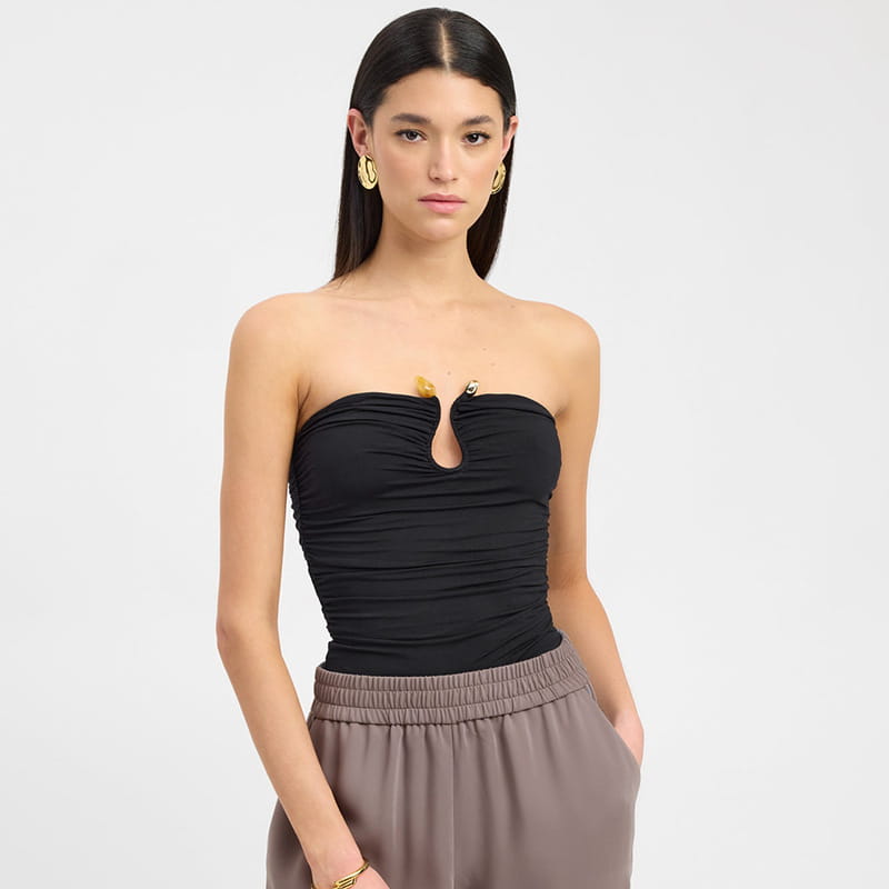 Black strapless keyhole crop top with ruched detailing and gold-tone hardware accents.