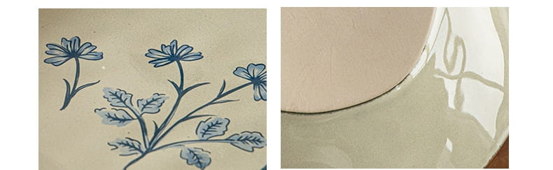A 9-inch ceramic deep plate features a delicate blue floral pattern on a creamy off-white surface.