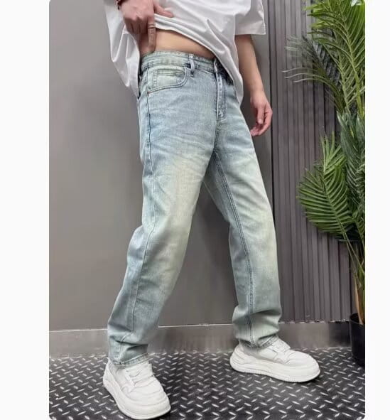 Men’s light wash denim jeans with a relaxed straight leg fit and subtle fading.
