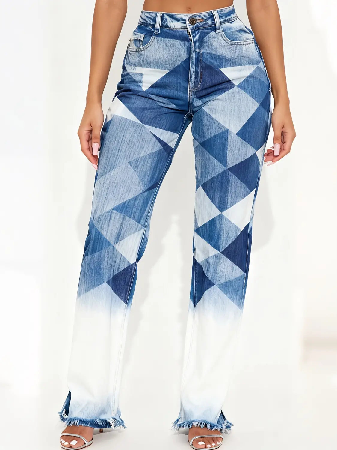 Straight leg medium wash denim jeans feature a high waisted design with a bold blue and white geometric pattern and frayed cuffs.