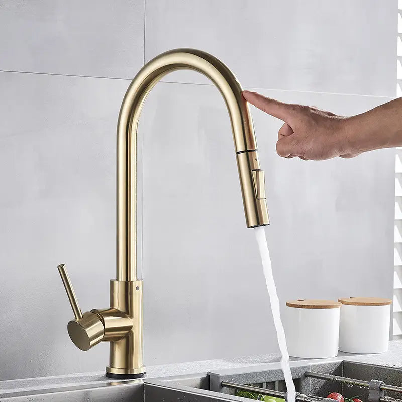 gold-toned sleek modern kitchen faucet with curved spout and pull-down spray head golden smart touch pull out kitchen faucet.