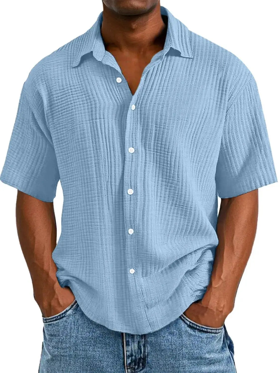 Light blue men’s short sleeve button up shirt made from textured ribbed fabric.