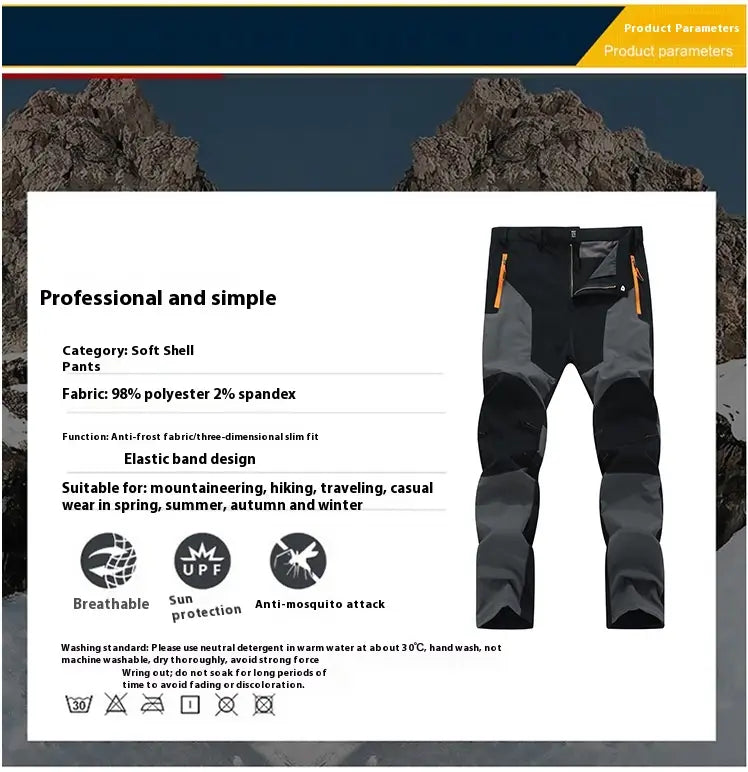Men’s waterproof tactical hiking pants in black and gray soft shell fabric with orange zipper accents.