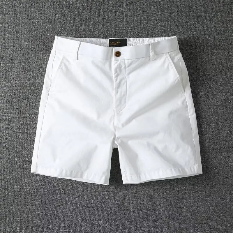men casual slim fit cargo shorts in white cotton featuring a classic button closure and elastic waistband.