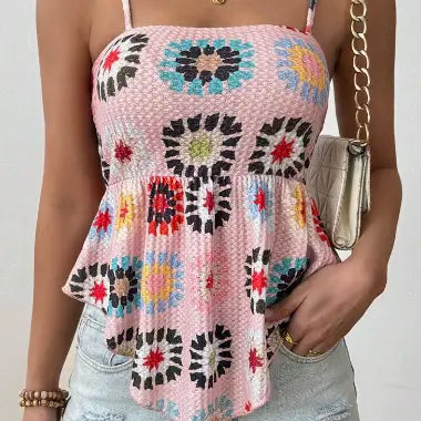 Pink crocheted floral peplum camisole top featuring colorful floral patterns and a peplum hem.