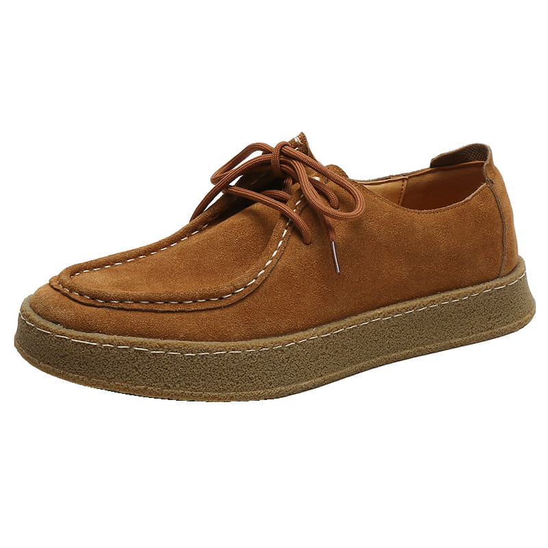 Brown suede British style casual lace-up leather shoe with matching laces and a textured rubber sole.