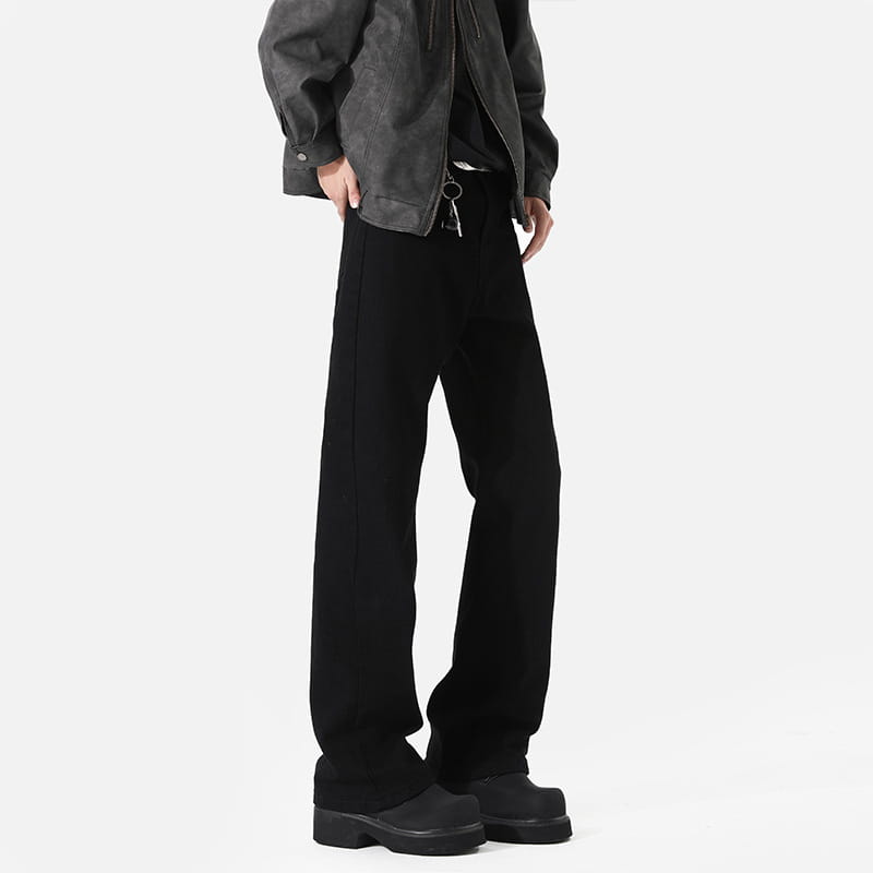 Modern black straight leg bootcut denim jeans featuring wide-leg trousers with a straight cut and subtle side seam detailing.