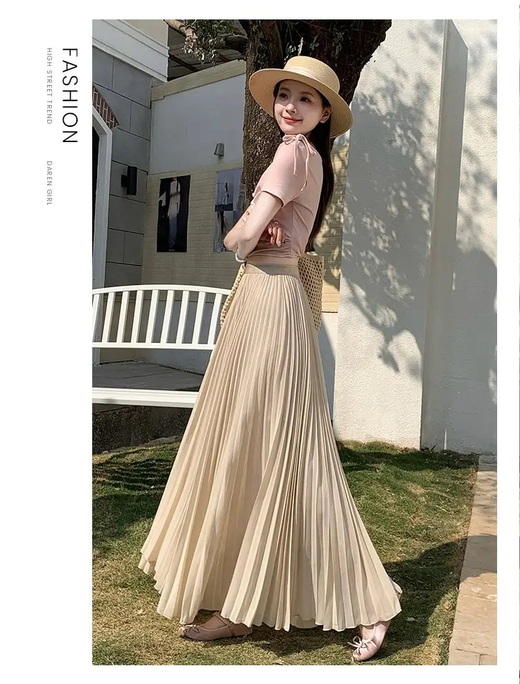 Beiger plissierter Chiffon-Midirock für Damen mit fließendem, mehrlagigem Design.