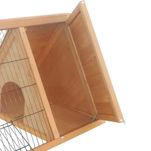 Light brown wooden A-frame rabbit hutch with wire mesh front and an open door revealing a circular entrance hole for outdoor small animal housing.