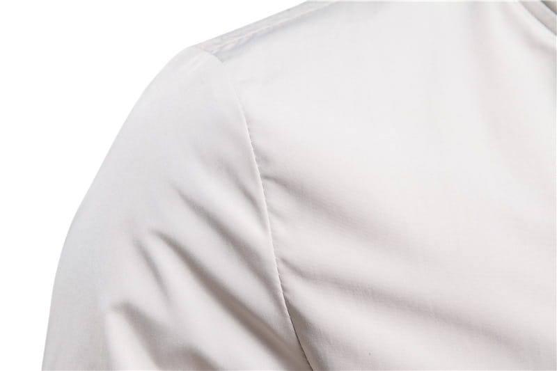 A crisp white cotton shirt with smooth textured fabric and clean stitching worn under a men’s bomber jacket casual zip outerwear.