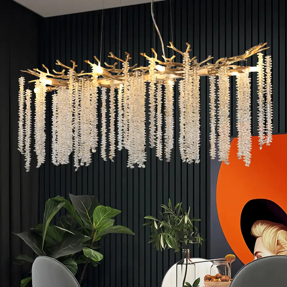 A 39 inch golden crystal waterfall pendant light featuring a branch-shaped chandelier design with cascading strands of clear crystal beads.