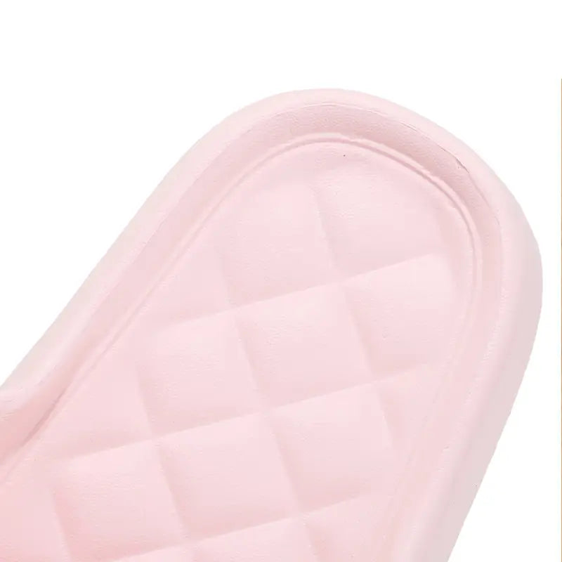 pink quilted rubber sole of dog cartoon slide sandals non slip eva house shoes shown from the back side