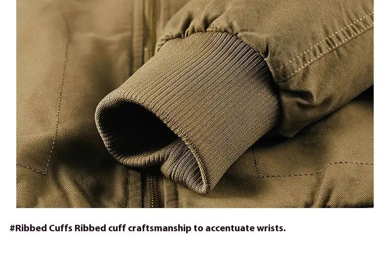 Close-up of the ribbed cuff on an olive green men cotton shearling bomber jacket showing neat stitching and a snug fit to accentuate wrists.