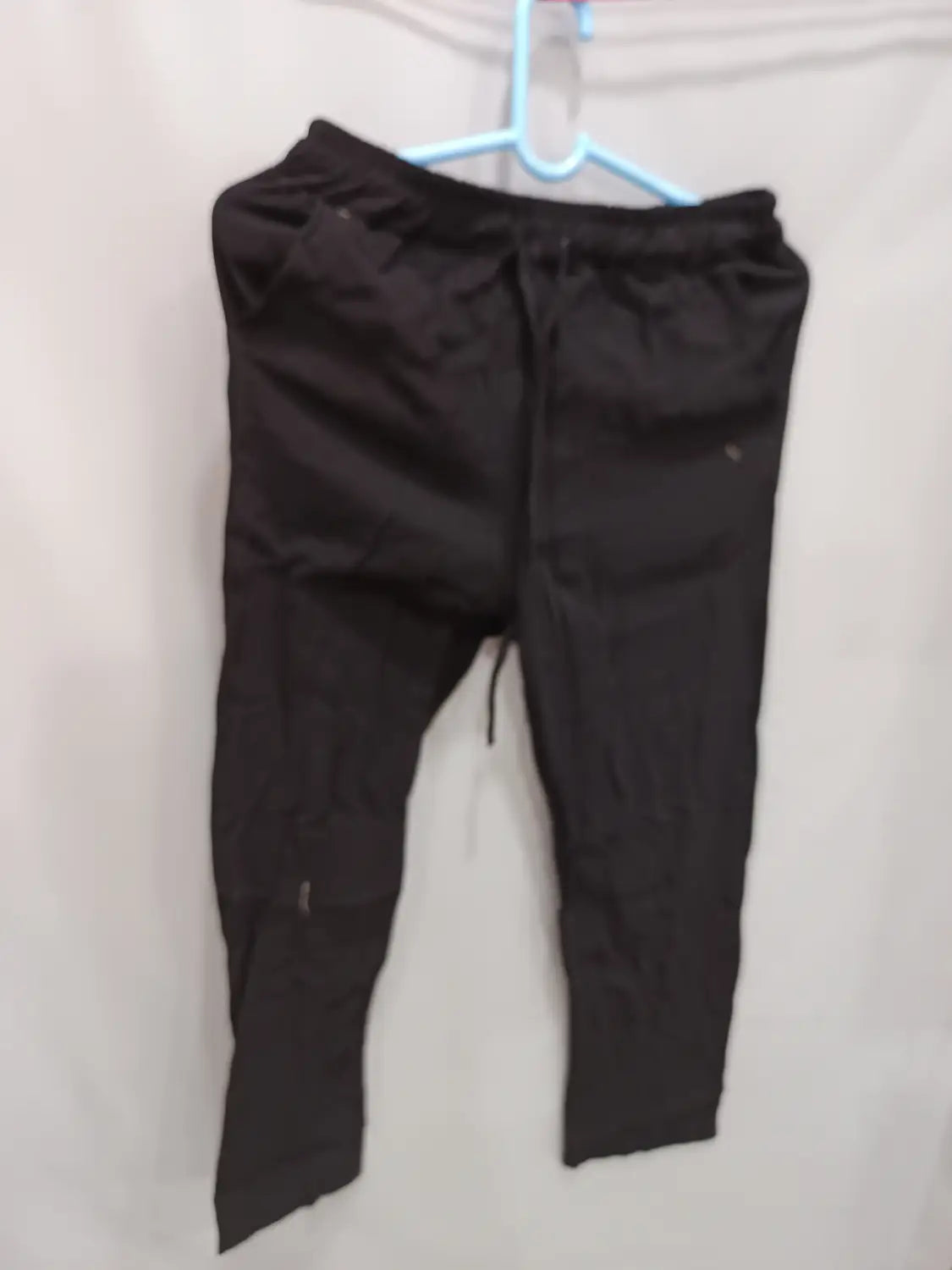 black linen men’s joggers with a relaxed fit drawstring waist and subtle side pockets designed for casual summer wear