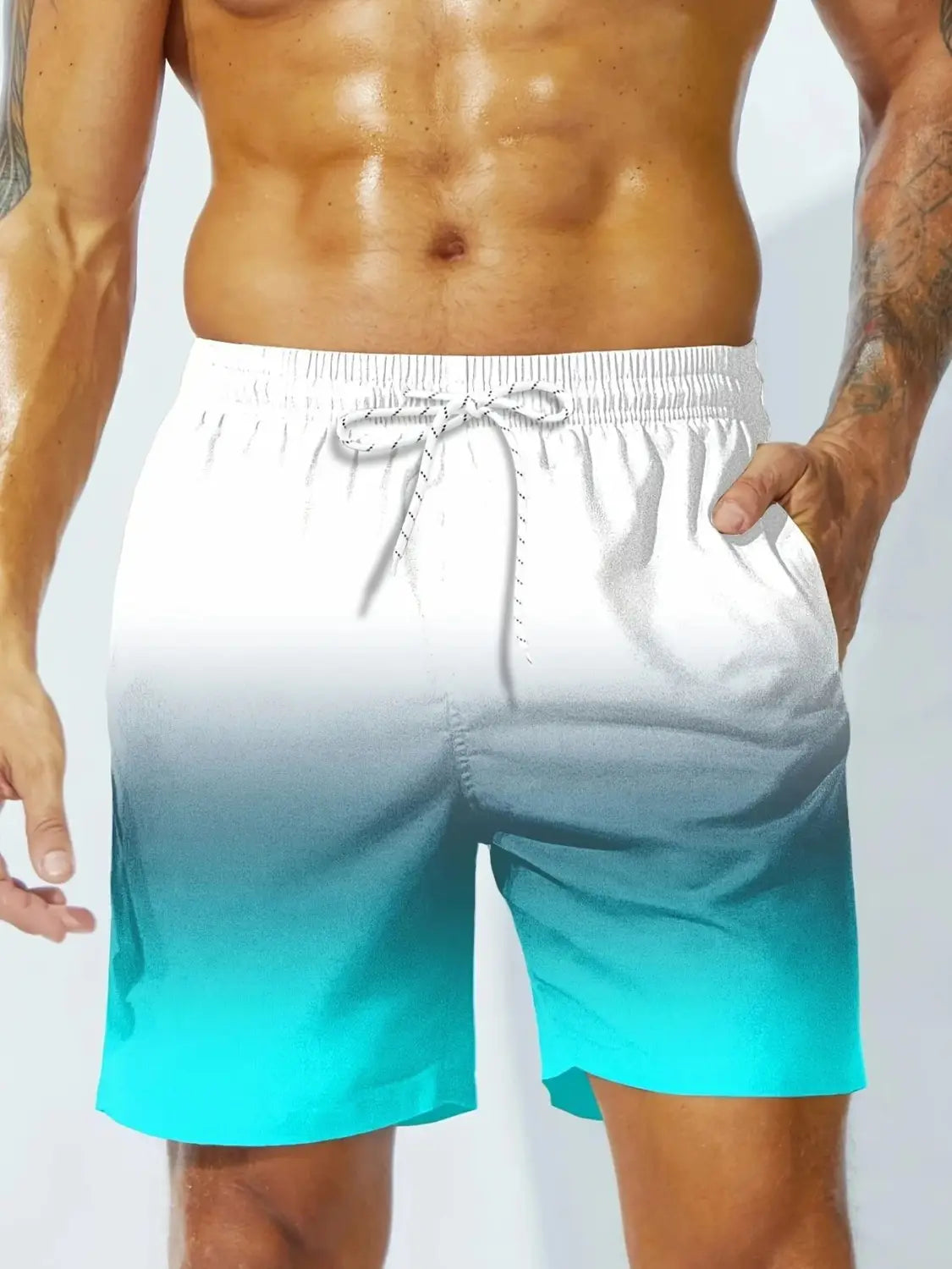 Men casual swim trunks feature a white and teal gradient design with a drawstring waistband ideal for tropical boardshorts use.