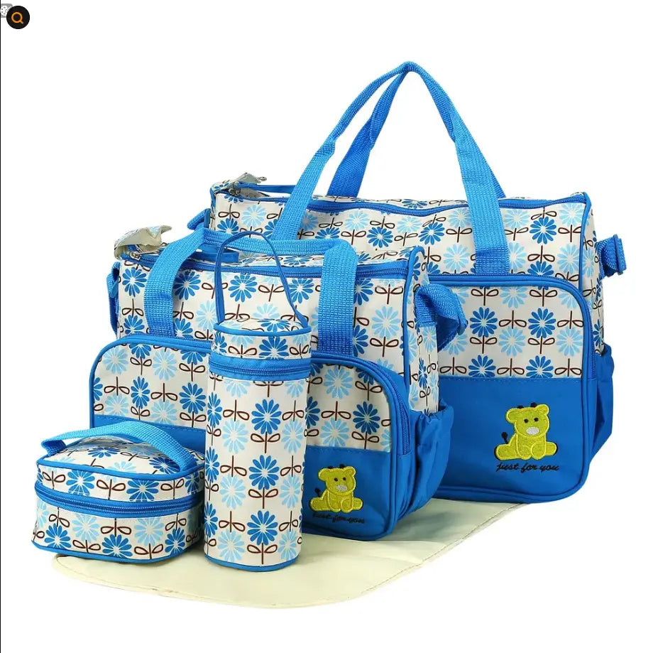 Blue floral-patterned 5 piece bear appliqué baby diaper travel bag set with a yellow teddy bear appliqué and matching blue handles designed for baby essentials.