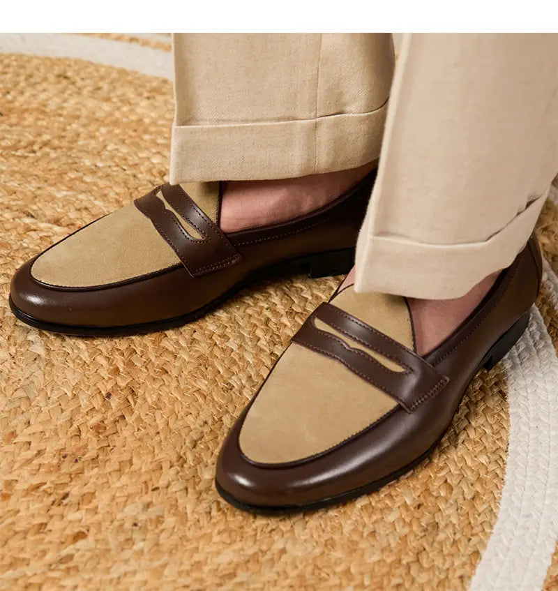 Two tone British style suede loafers in brown and beige with a polished leather strap across the toe and a block heel.