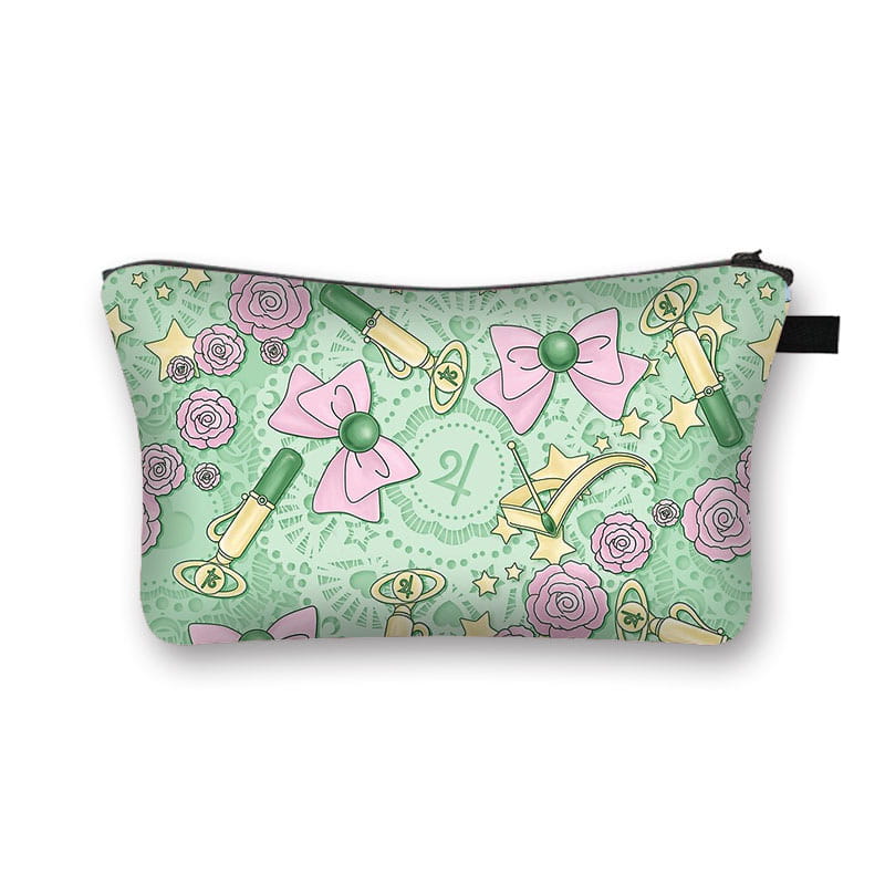 Pastel green cosmetic bag whimsical bow and lace travel clutch adorned with pink bows roses and golden crescent moons in a whimsical pattern.