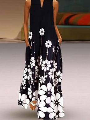 Une robe longue maxi sans manches noire à dentelle florale appliquée blanche audacieuse, avec encolure en V et poches latérales.