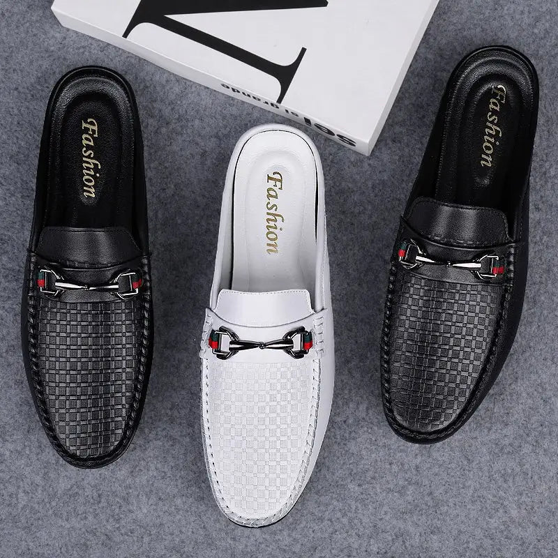 Men’s leather mule loafers featuring black and white woven leather with silver horsebit buckles accented by red details.