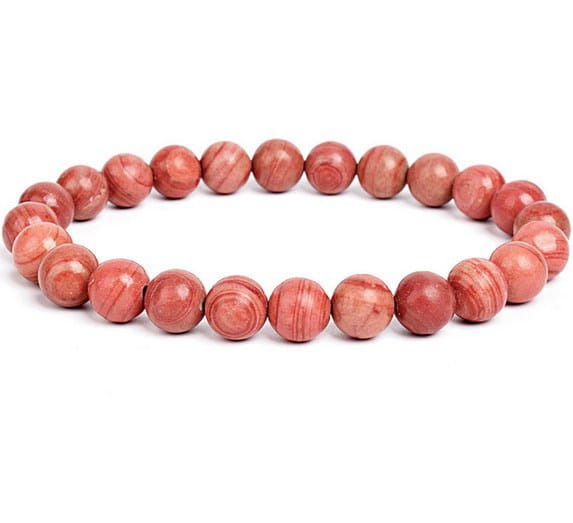 A unisex 8mm polished agate and amethyst stretch bracelet featuring smooth round coral-colored beads with natural striations and a polished finish.