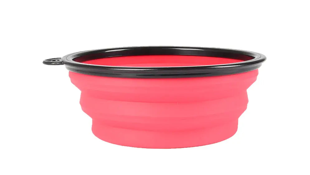 Bol pour animaux de compagnie en silicone rabattable rose, avec bord noir et poignée, issu du lot de 4 bols pliables en silicone Slow Food, conçu pour l’alimentation portable.